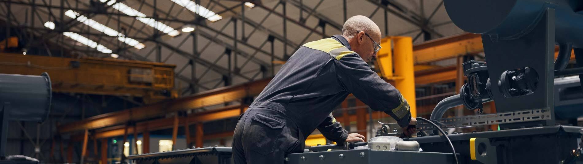 Technician working on a Wilson Power Solutions transformer